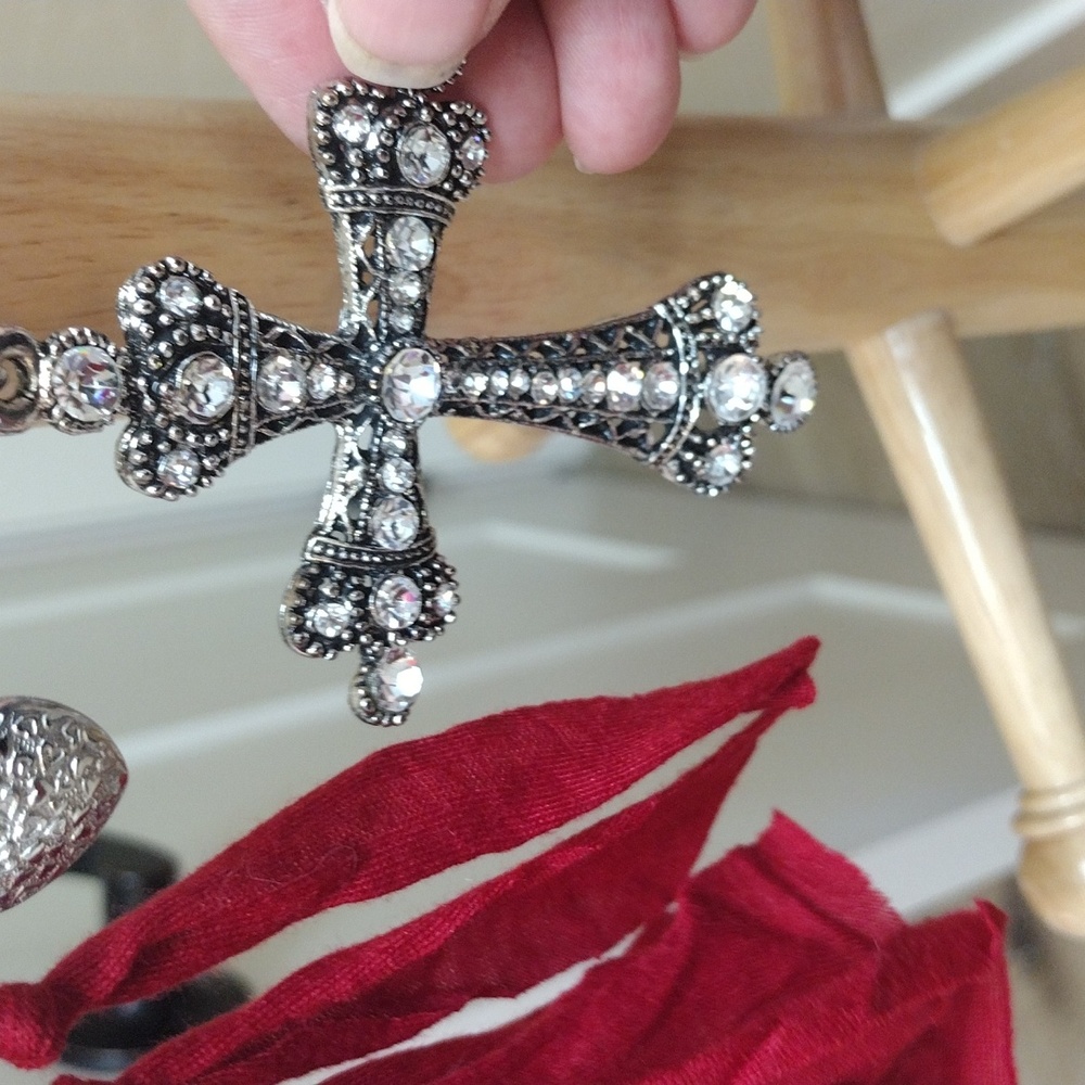 Wrap around scarf with Cross and silver tone embellishments.
